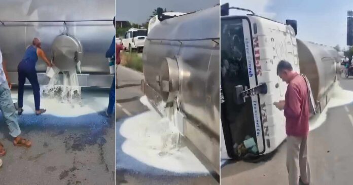 people-rush-in-with-buckets--bottles-as-milk-tanker-overturns-on-delhi-jaipur-highway